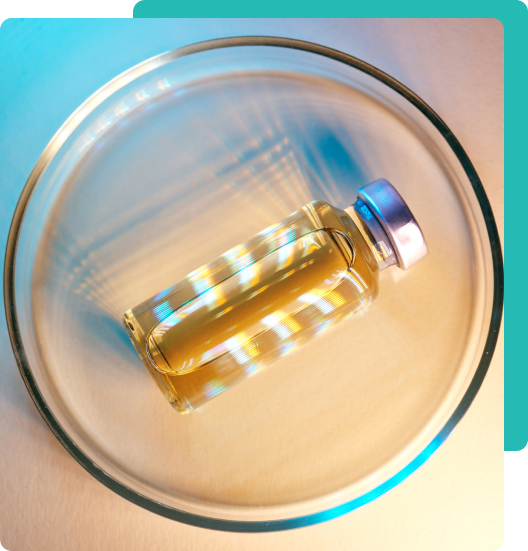 A peptide vial in a petri dish representing verified sourcing at Wellness House NYC