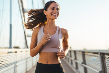 Woman running outdoors representing energy from vitamin and IM shots